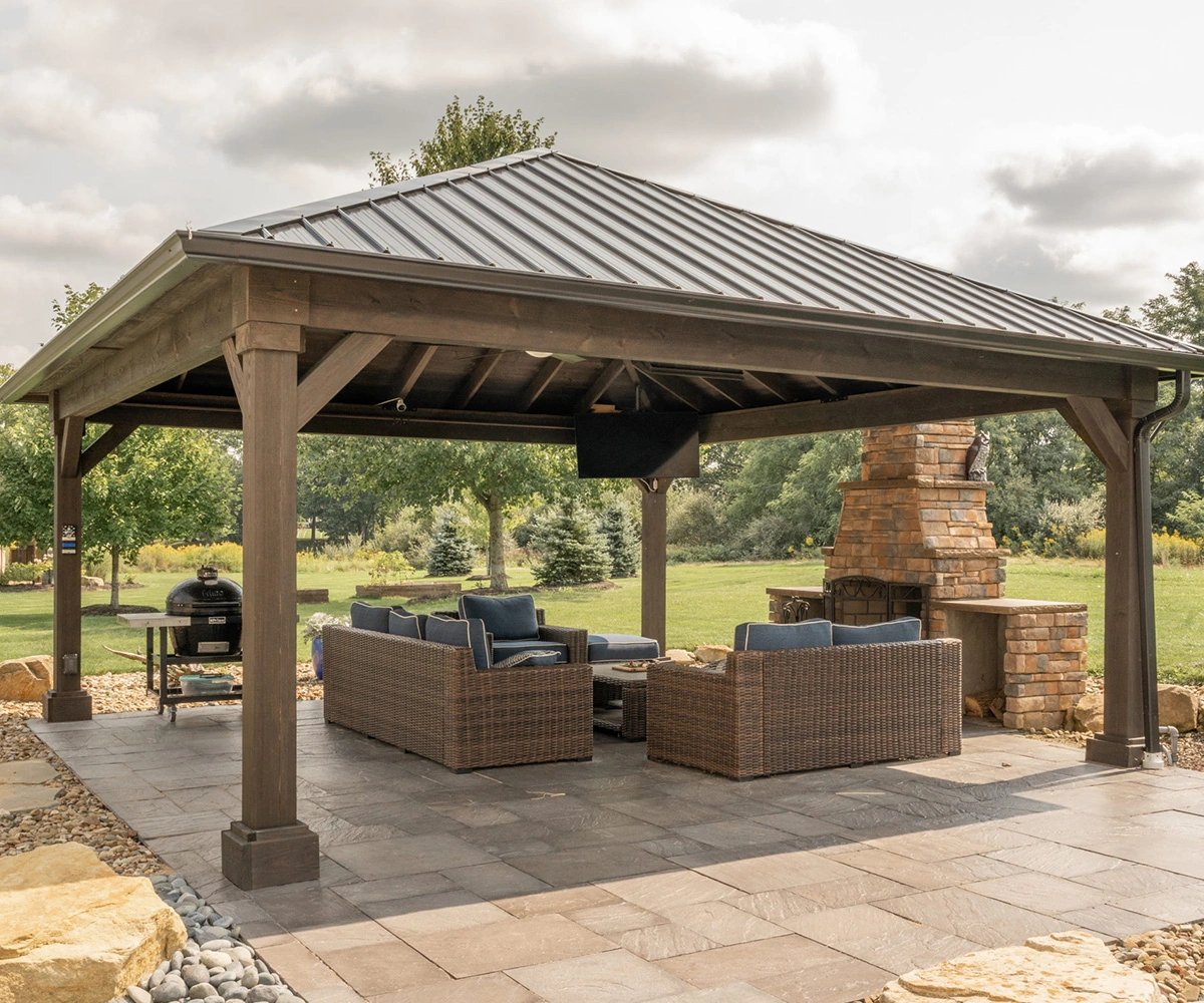 Wood outdoor pavilion with a hip-style roof and heavy support posts