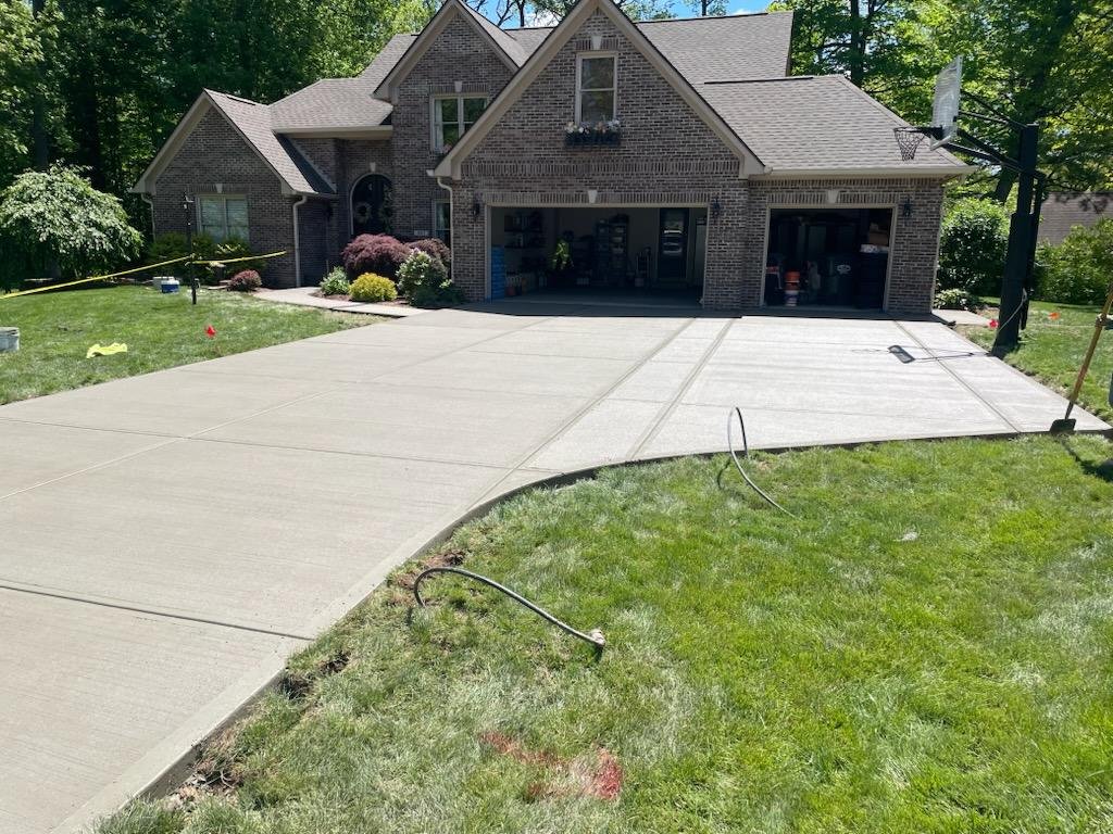 Wide concrete driveway replacement completed for a home in Avon Indiana