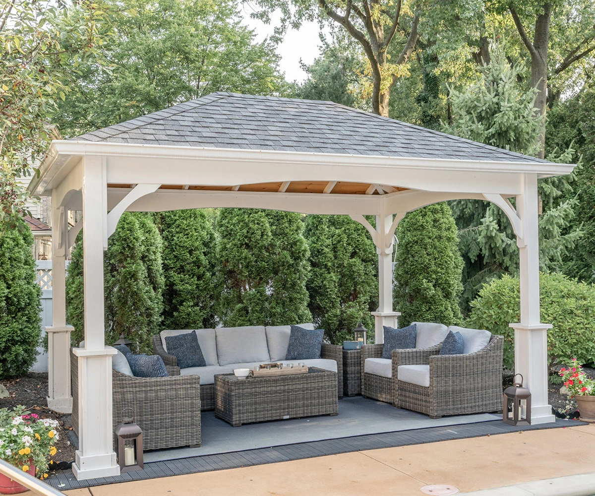 Traditional wood pavilion with a finished roof over an outdoor patio