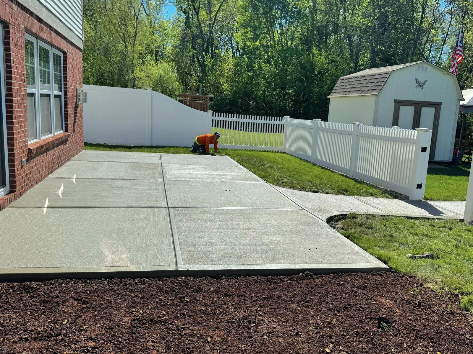 New concrete patio replacing an old backyard patio